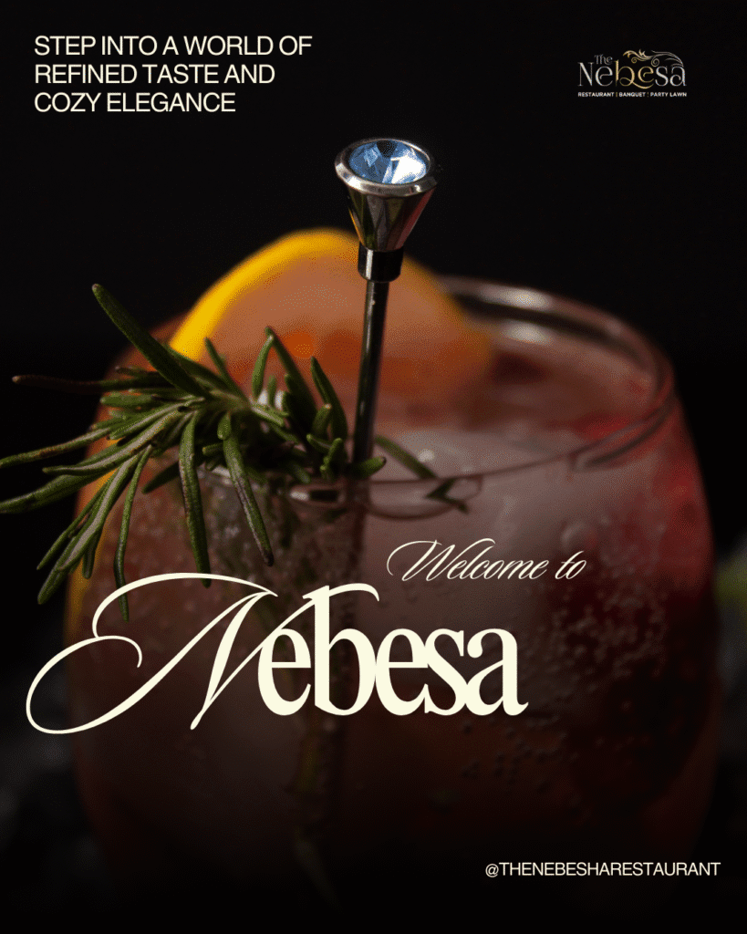 Fresh fruit juice served in a glass with citrus slices and mint garnish.